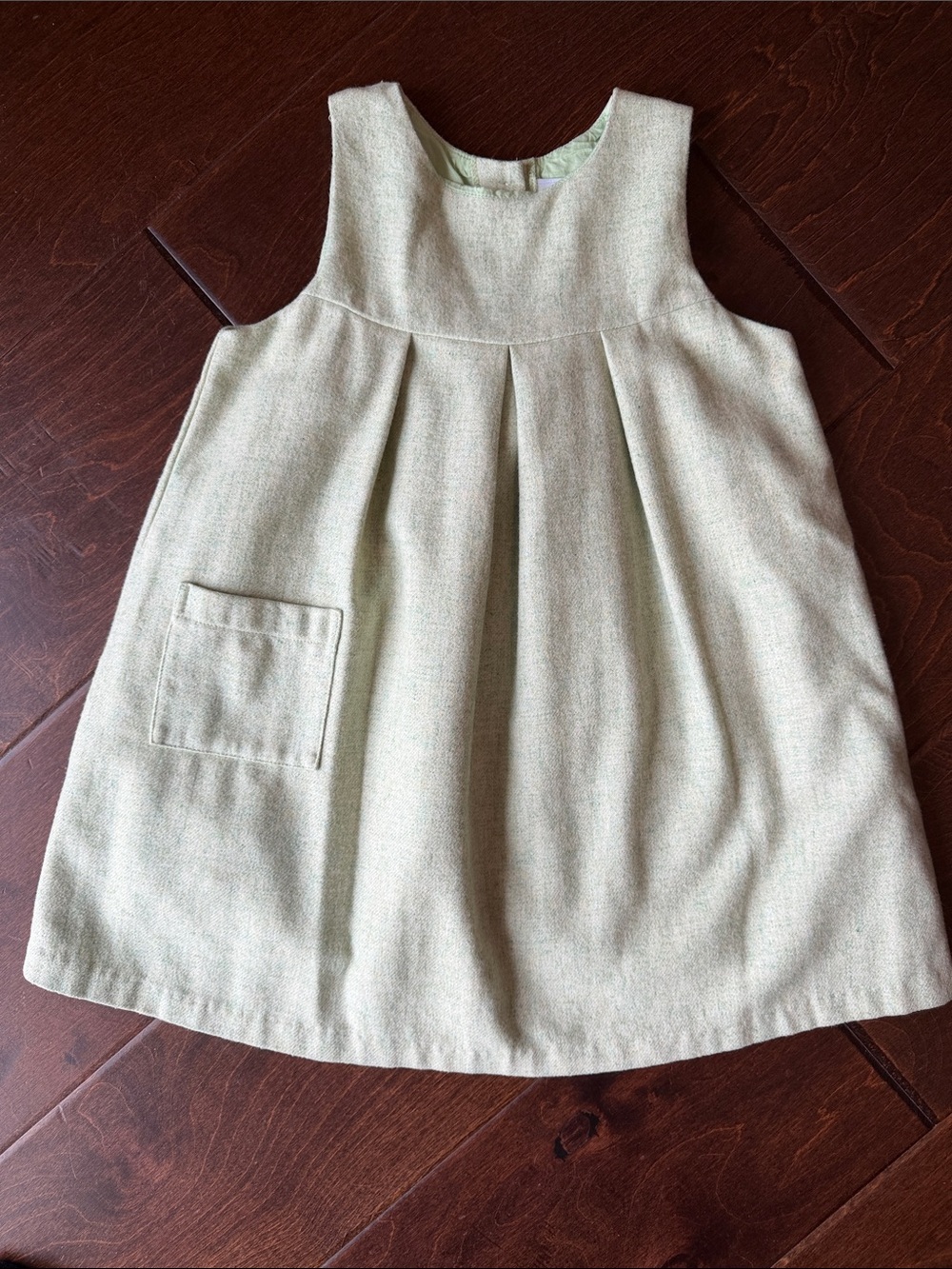 LITTLE ENGLISH: A classic sleeveless pinafore dress